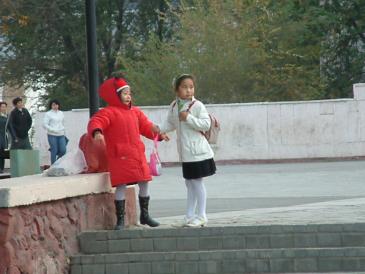 Robert X Bishop photographs two Kazak little girls while visiting Kazakhstan to negotiate a communications and security contract